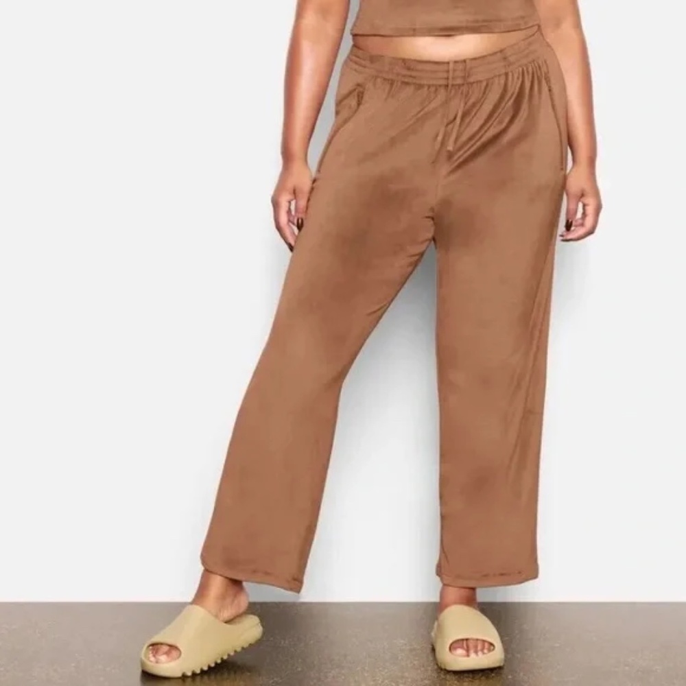Skims Velour Track Pants in Sienna